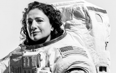 Jessica Meir &rsquo;99 poses in her spacesuit