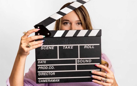Image of Cathy Campo with a director's clapper