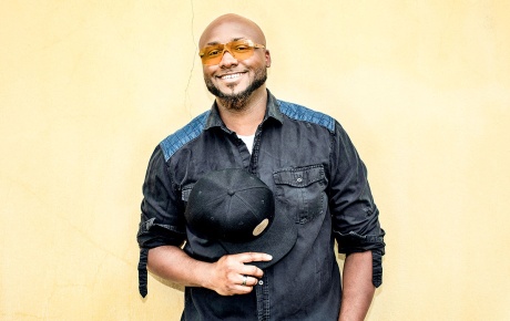 Image of a smiling Granger Simmons with a yellow background.