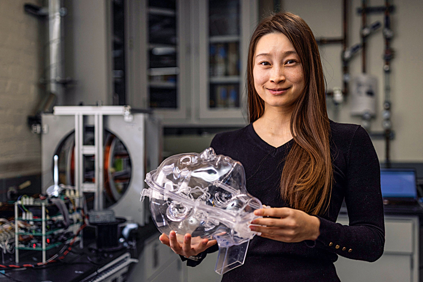 Renee Zhao holding a scientific tool