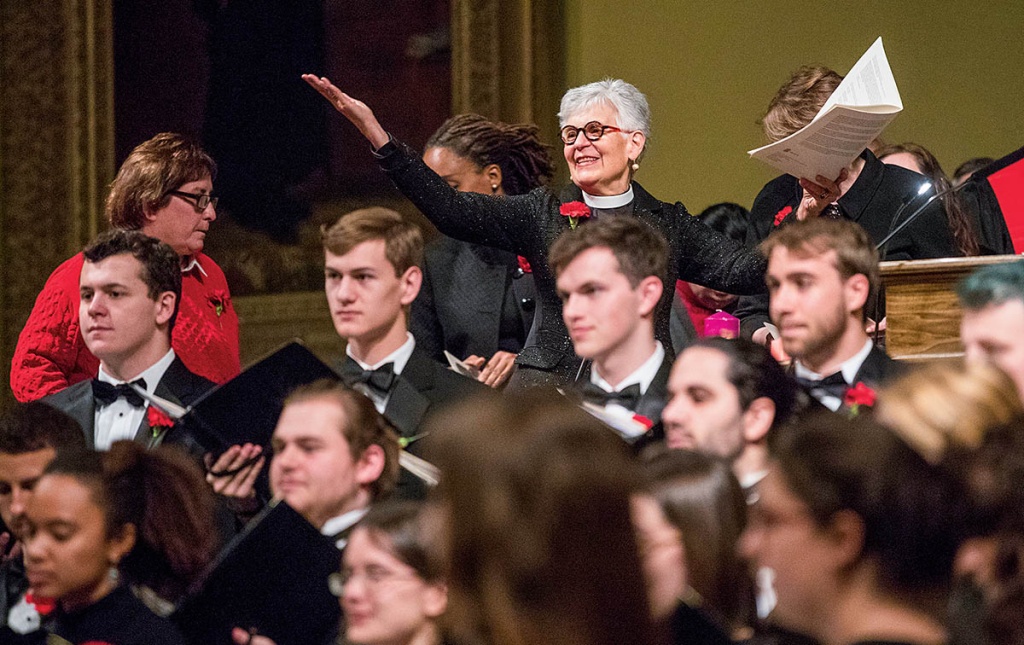 An image of Janet Cooper Nelson with students in tuxes in the foreground